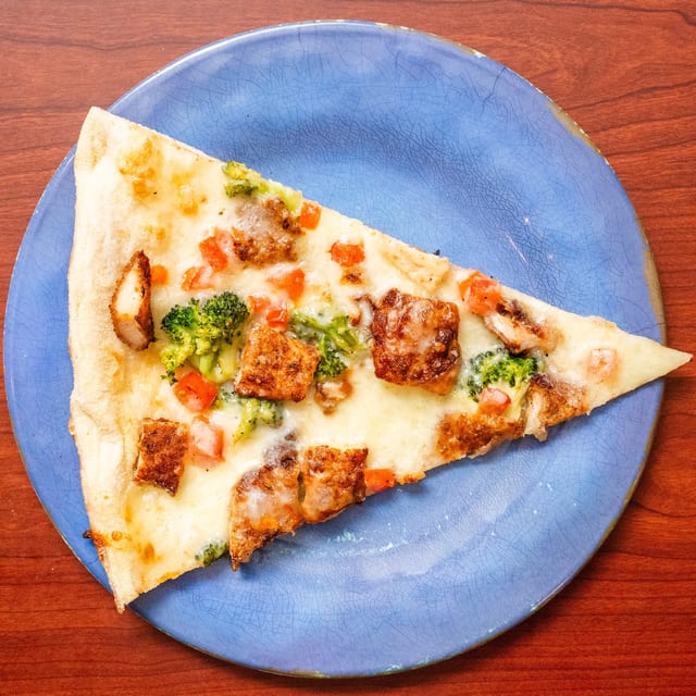Chicken, Broccoli & Fresh Tomato Pizza.